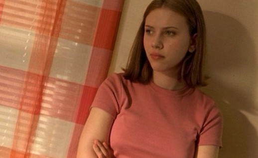 Young and sexy Scarlett Johansson in a pink shirt.