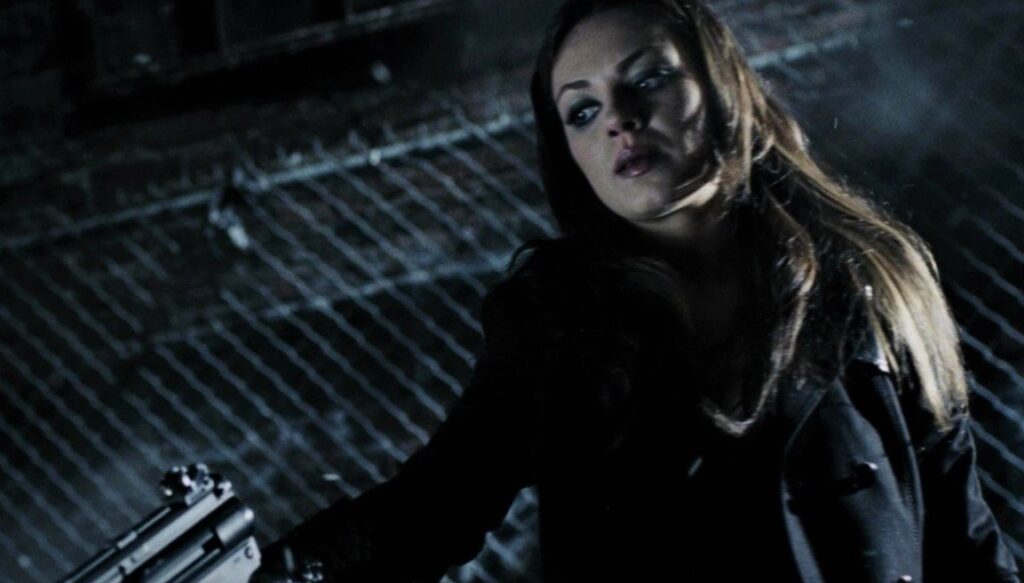 Mila Kunis Holding a gun in Max Payne (2008).