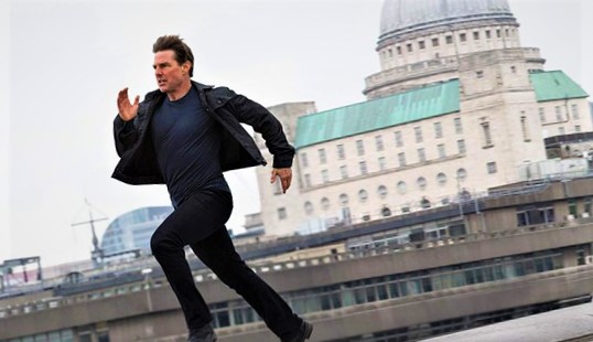 Ethan Hunt (Tom Cruise) running on top of buildings in Mission Impossible.