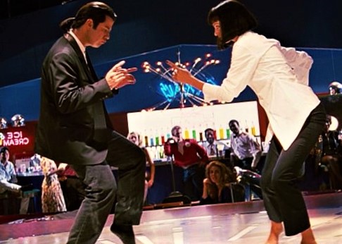 John Travolta and Uma Thurman Dancing on the floor.