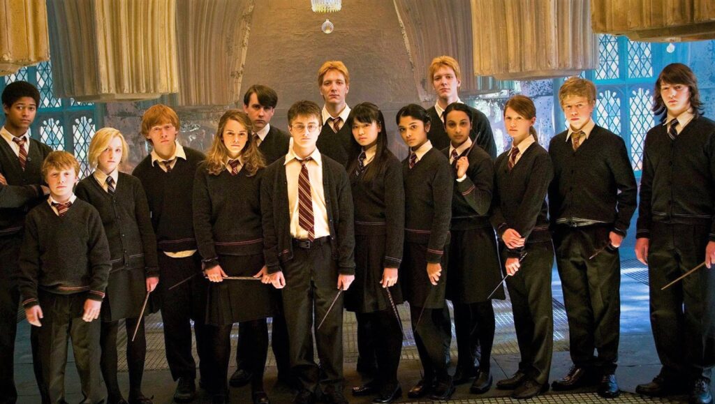 Harry Potter team holding their wands. 