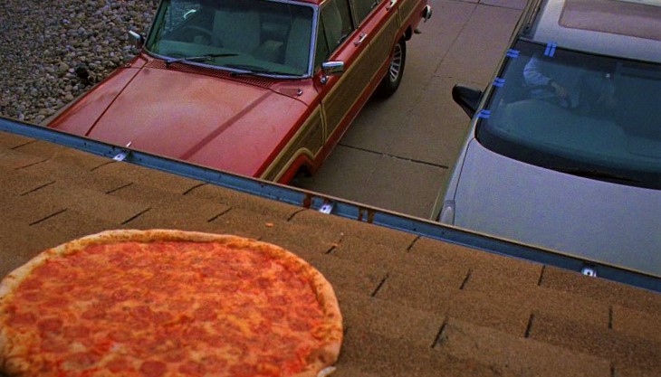 Walter White throws pizza on rooftop in Breaking Bad.