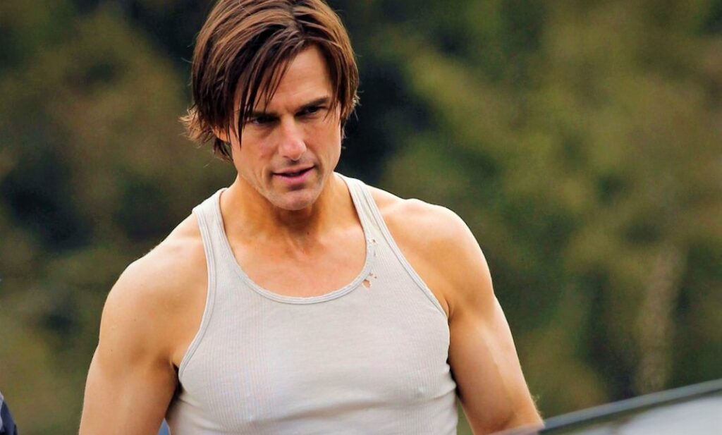 Tom Cruise looking sexy in white tank top.