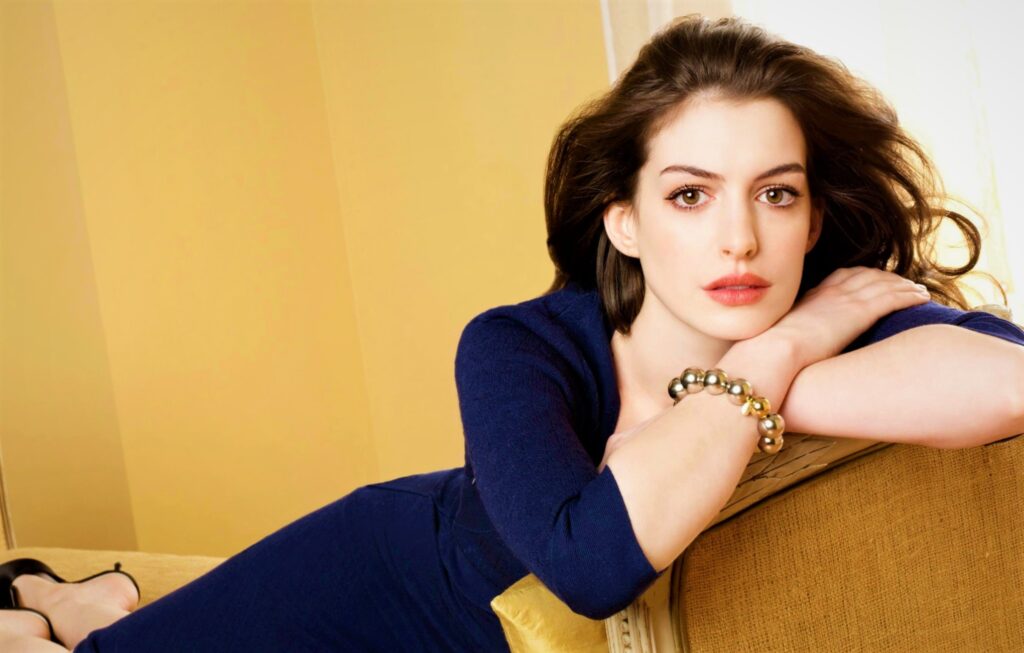 Anne Hathaway looking sexy on Sofa